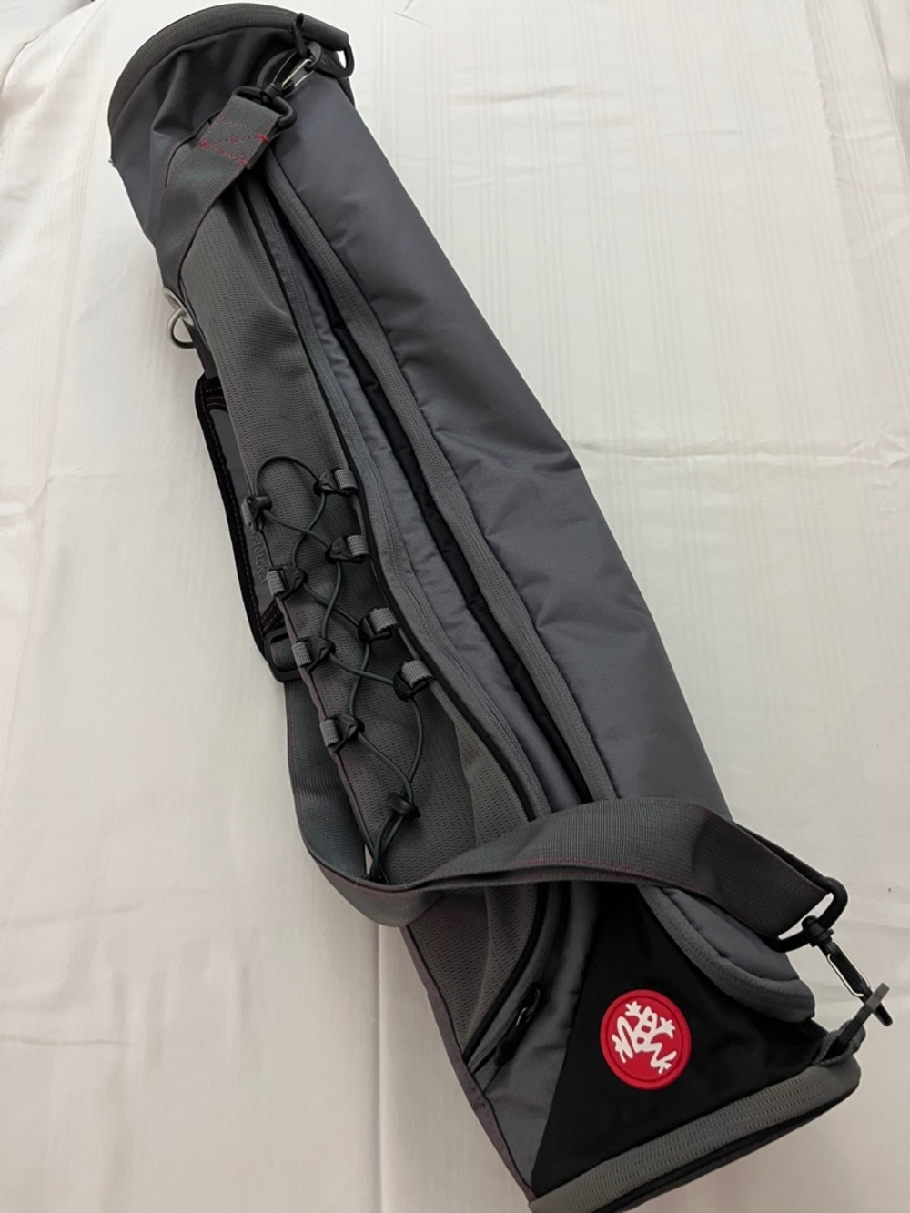 Manouka gray yoga mat bag with red accents and 1 side pocket